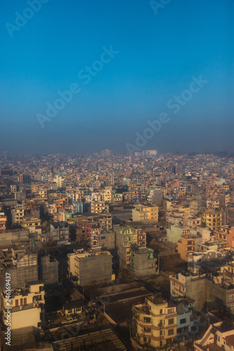Aerial view of Kathmandu dense building with blue sky.