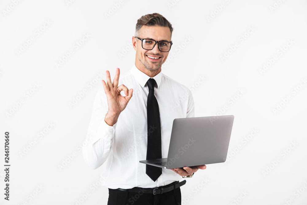 Handsome business man isolated over white wall background using laptop computer. Handsome business man isolated over white wall background using laptop computer.
