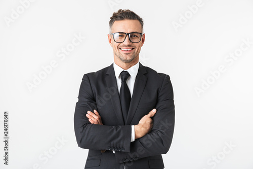 Handsome business man isolated over white wall background posing.