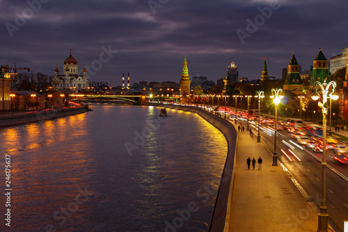 Embankments of Moskva river against Cathedral of Christ the Saviour and Moscow Kremlin at night. City landscape