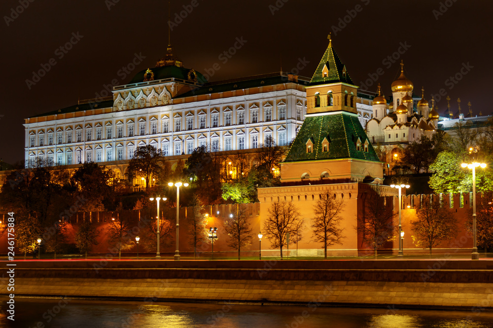 Grand Kremlin Palace on a background of wall and tower of Moscow Kremlin with night illumination