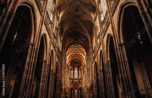 Interior of Gothic Cathedral inside. Carved pulpit, stained-glass Windows through which light rays penetrate building