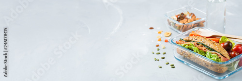 Tableau sur toile Lunch box with sandwich, fruits, vegetables, nut mix and water