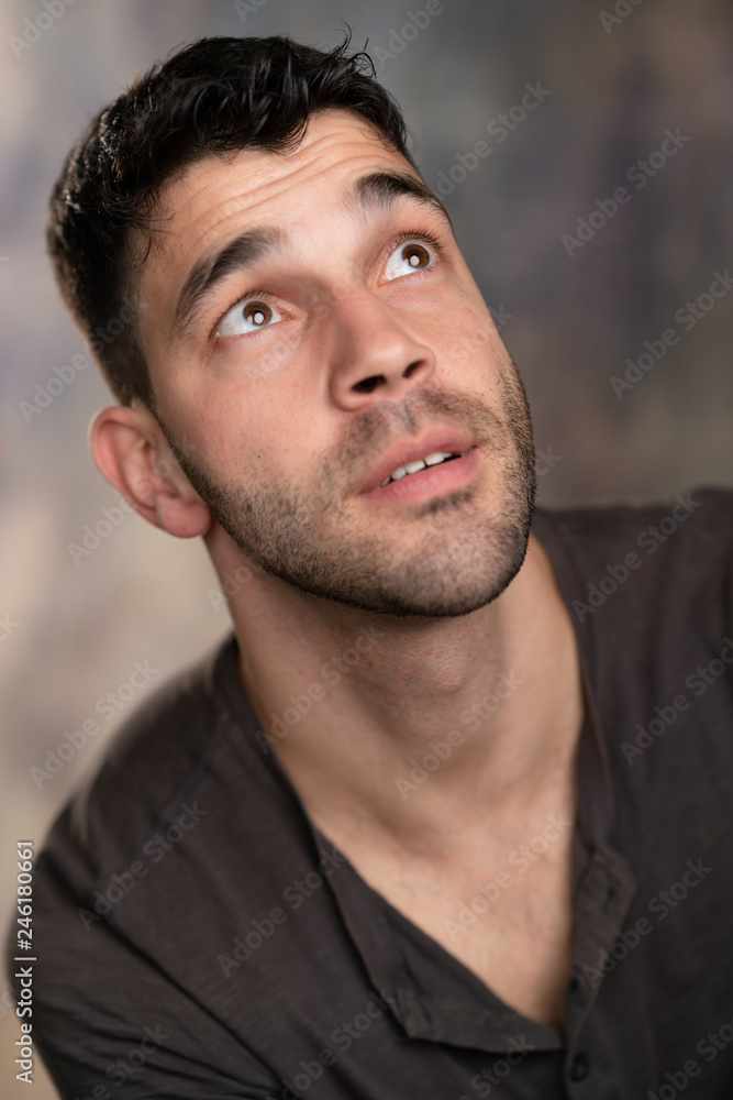 Handsome caucasian white male with black short hair and stubble with brown  t shirt, silly face Stock Photo | Adobe Stock