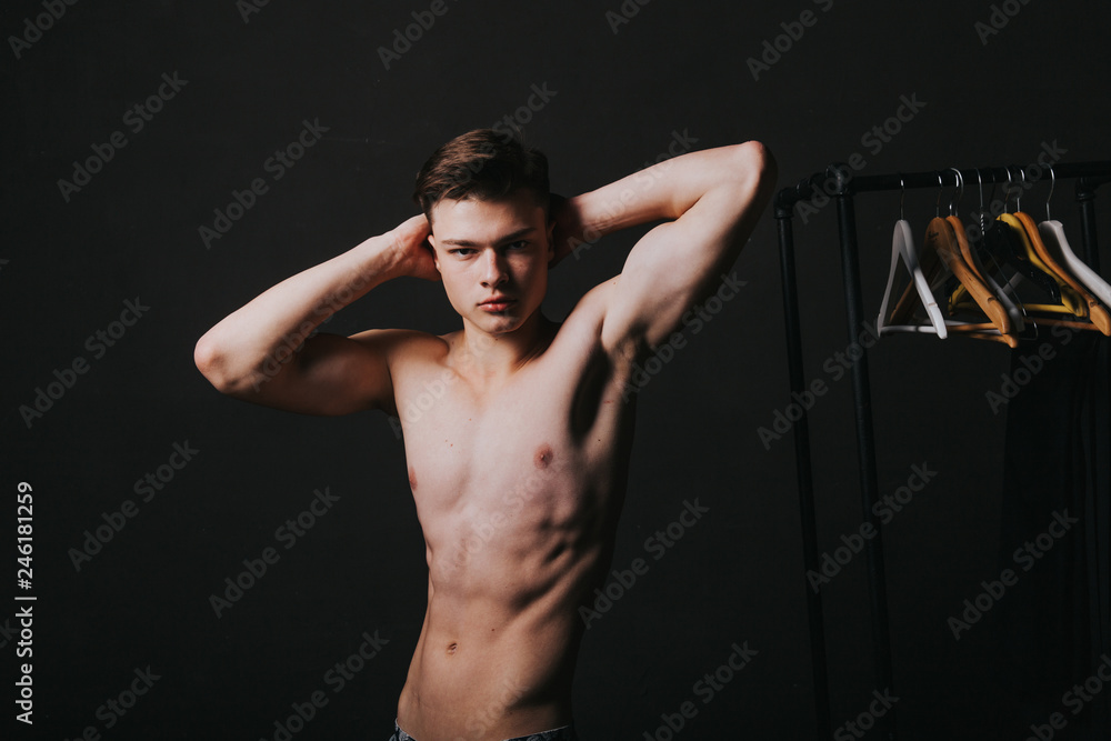 Handsome guy in jeans with bare tors. Handsome young man posing at studio. - Image Handsome guy in jeans with bare tors. Handsome young man posing at studio. - Image