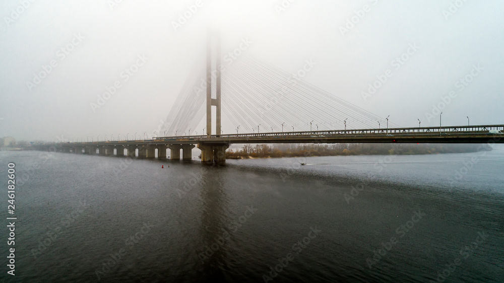 Bridge in the fog. Aerial view of South subway cable bridge. Kiev, Ukraine.