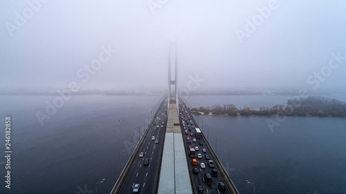 Bridge in the fog. Aerial view of South subway cable bridge. Kiev, Ukraine. © ronedya