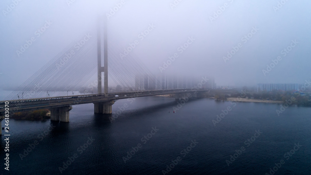 Bridge in the fog. Aerial view of South subway cable bridge. Kiev, Ukraine.