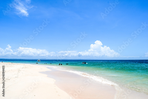 Fototapeta Naklejka Na Ścianę i Meble -  Tropical island, idyllic beach with some tourists, Caribbean sea
