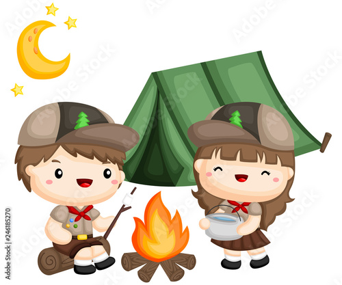 a boy and girl scouts cooking outside the tent
