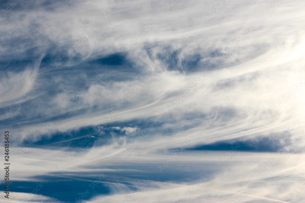 blue sky background with contrails and clouds blue sky background with contrails and clouds