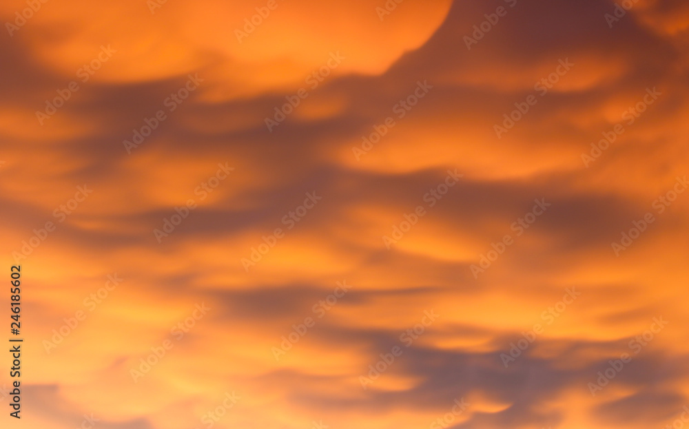 Orange sky with clouds, beautiful background