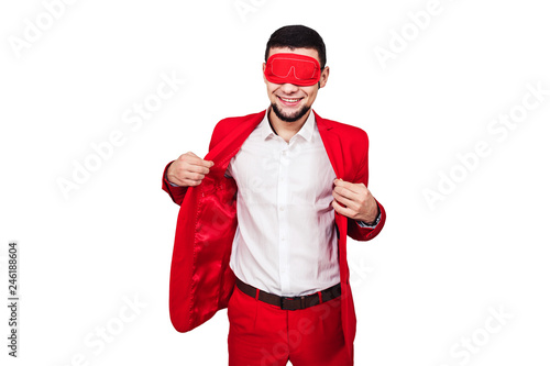 young businessman relies on luck, fortune. bearded man in a red suit with a red blindfold