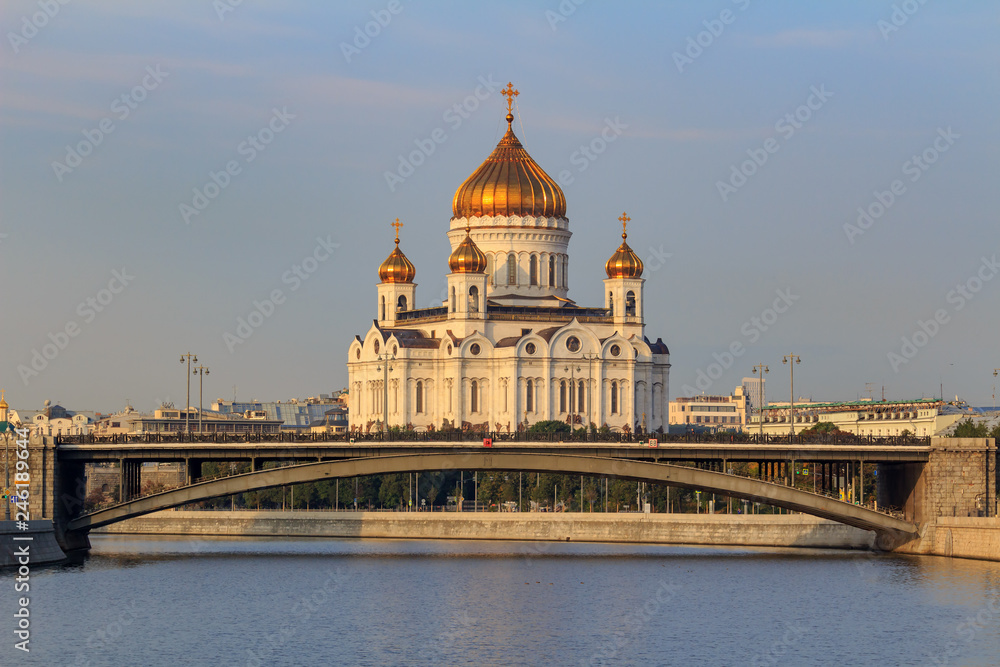 Cathedral of Christ the Saviour in Moscow against Moskva river and Bolshoy Kamennyi Bridge in sunny autumn morning