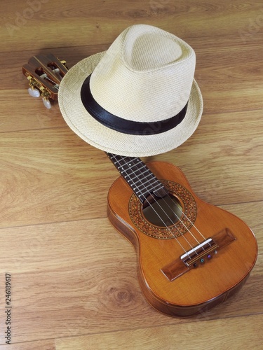 Fototapeta Naklejka Na Ścianę i Meble -  A samba player (sambista) hat and a cavaquinho, a small Brazilian string musical instrument. It is widely used to accompany samba and choro, two popular Brazilian rhythms.