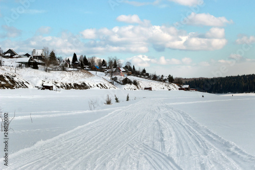 village and road in winter