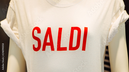 Italian shopping sale banner, special offer, saldi - white t-shirt with red saldi print (inscription). photo