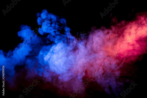 Beautiful horizontal column of smoke in the neon bright light of blue pink and orange on a black background exhaled out of the vape.
