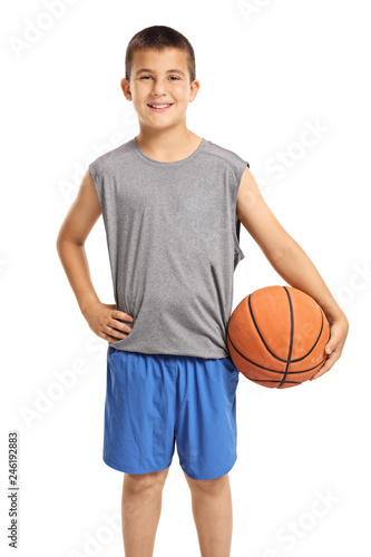 Smiling boy posing with a basketball