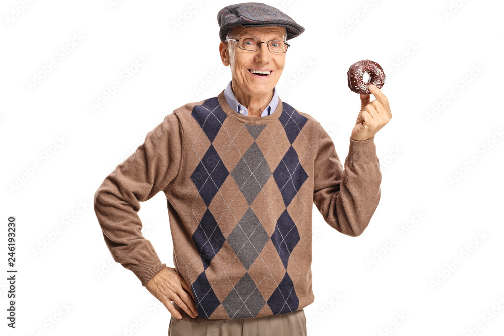 Cheerful senior man holding a chocolate donut Cheerful senior man holding a chocolate donut