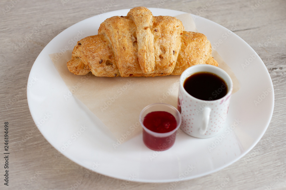breakfast with croissant. coffee and jam breakfast with croissant. coffee and jam