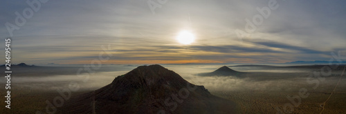 foggy sunset in the mountains panorama