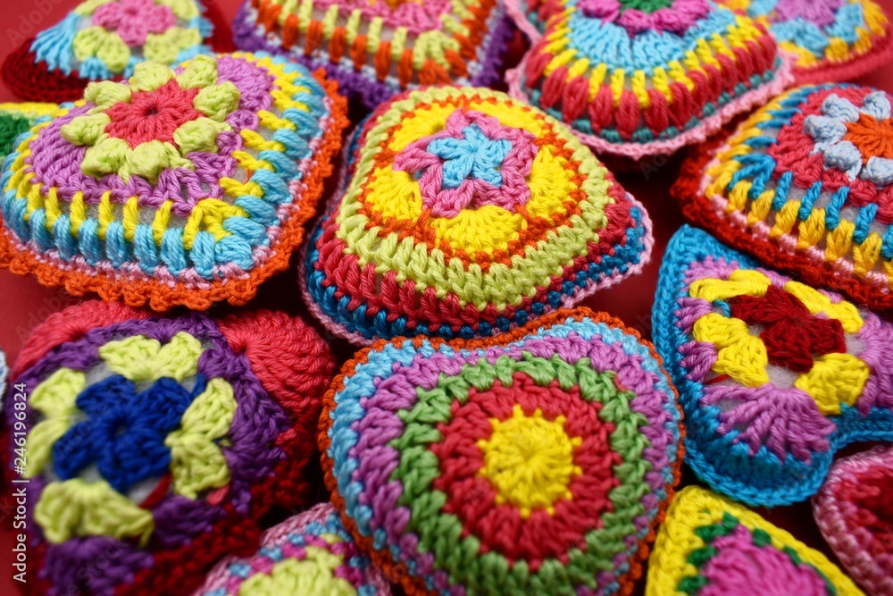 Knitted hearts of colored yarn closeup. Valentine's Day, background, design, creative.