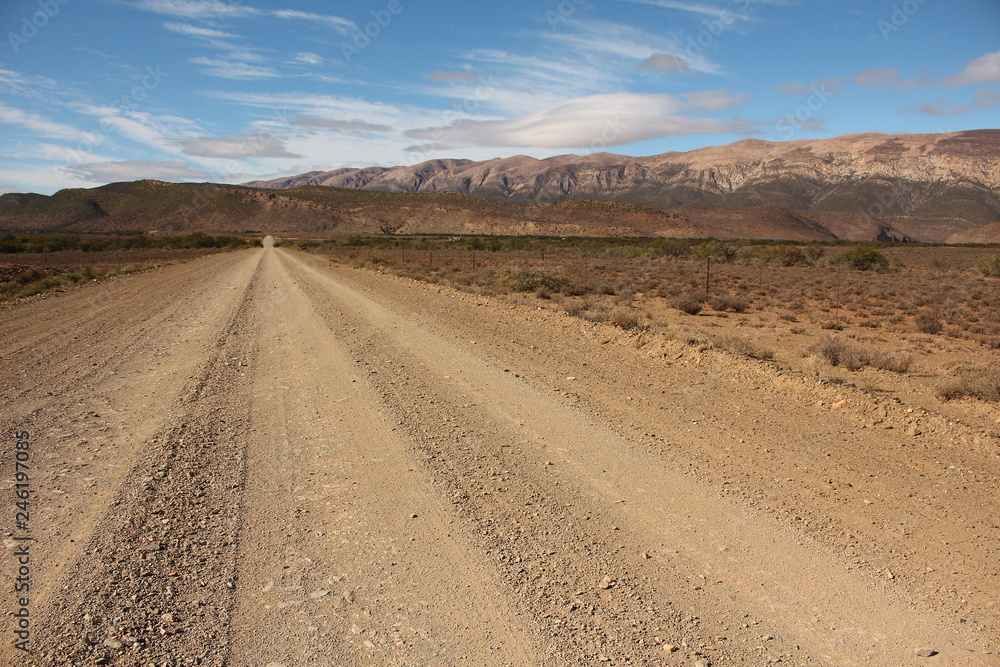 Gravel road through the arid southern Karoo in South Africa.