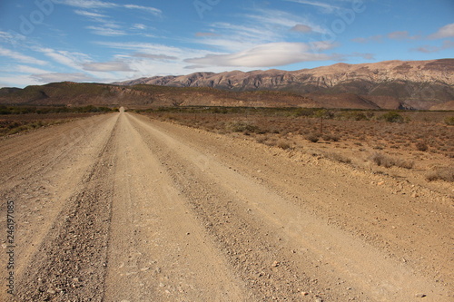 Gravel road through the arid southern Karoo in South Africa.