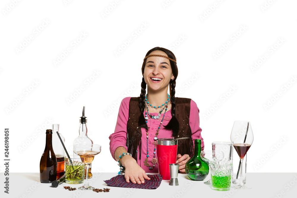 Expert female barman is making cocktail at studio isolated on white background. International barman day, bar, alcohol, restaurant, party, pub, nightlife, cocktail, nightclub concept Expert female barman is making cocktail at studio isolated on white background. International barman day, bar, alcohol, restaurant, party, pub, nightlife, cocktail, nightclub concept
