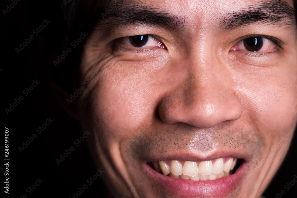 A portrait of smiling man because of the happiness of being a lottery winner. Smiling is represent a happy, friendly and positive emotion. His age is 36 years old. A portrait of smiling man because of the happiness of being a lottery winner. Smiling is represent a happy, friendly and positive emotion. His age is 36 years old.