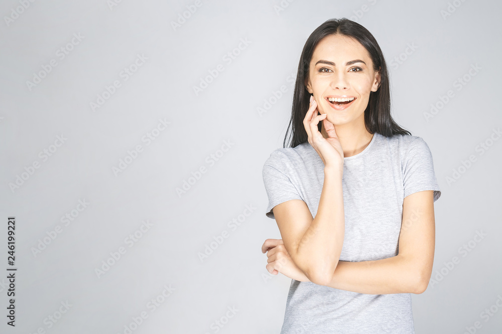 Portrait of a smiling pretty woman looking at camera isolated on a white background Portrait of a smiling pretty woman looking at camera isolated on a white background