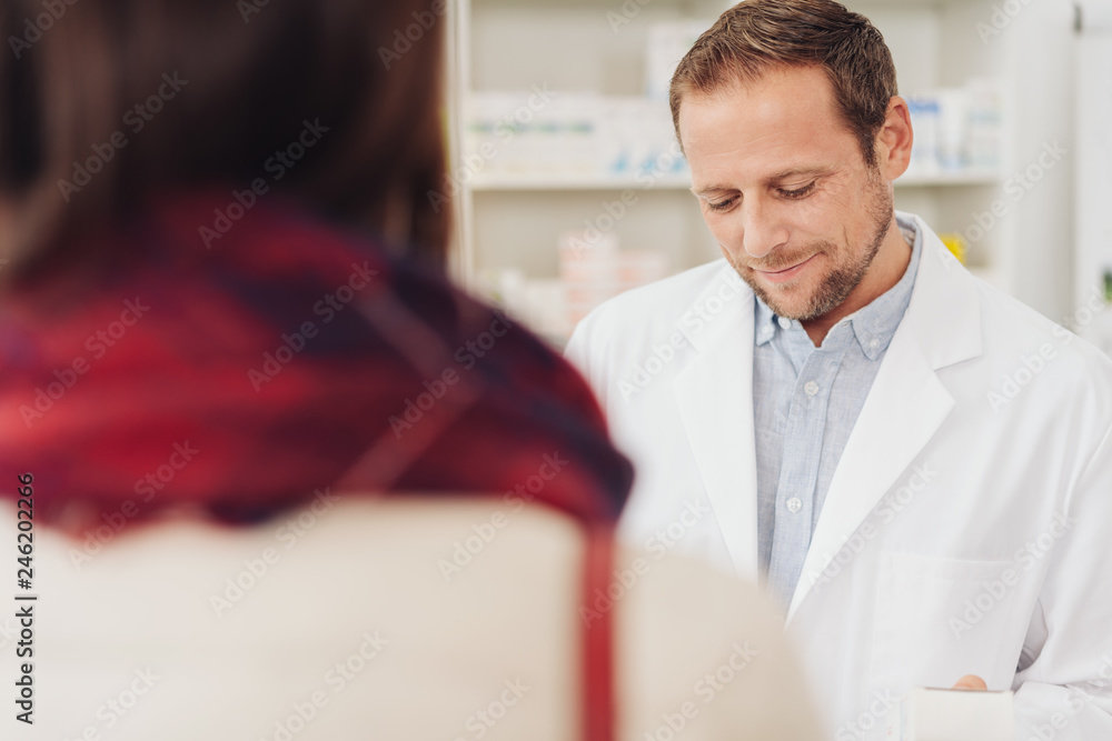 Pharmacist attending to a female client Pharmacist attending to a female client