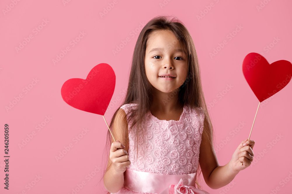 cute little girl in a pink dress holding a paper heart cute little girl in a pink dress holding a paper heart