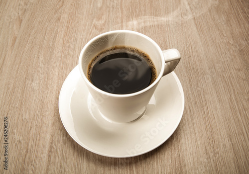 coffee still life from a cup of black coffee on a wooden table