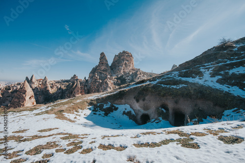 Cappadocia, a semi-arid region in central Turkey, is known for its distinctive “fairy chimneys,” tall, cone-shaped rock formations clustered in Monks Valley, Göreme and elsewhere. 