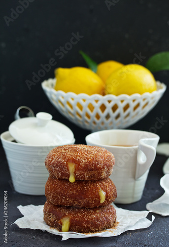 Donuts with cinnamon and lemon cream. Homemade baking. Selective focus.