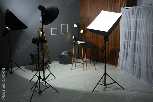 Example of living room interior design and professional equipment in photo studio