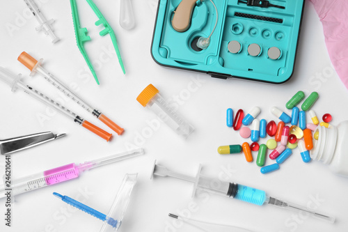 Flat lay composition with different medical objects on white background