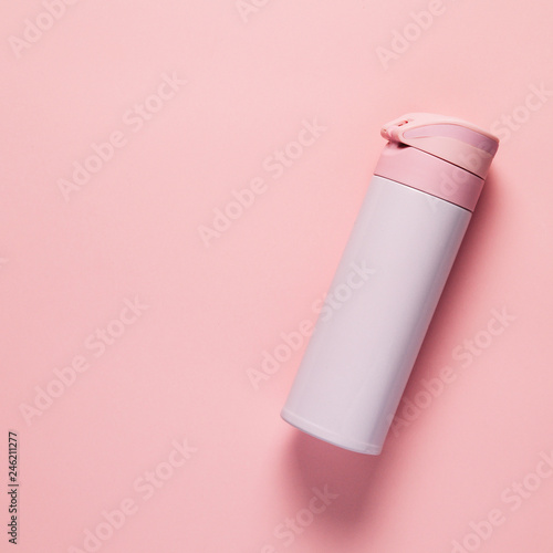 Pink thermos on pink background