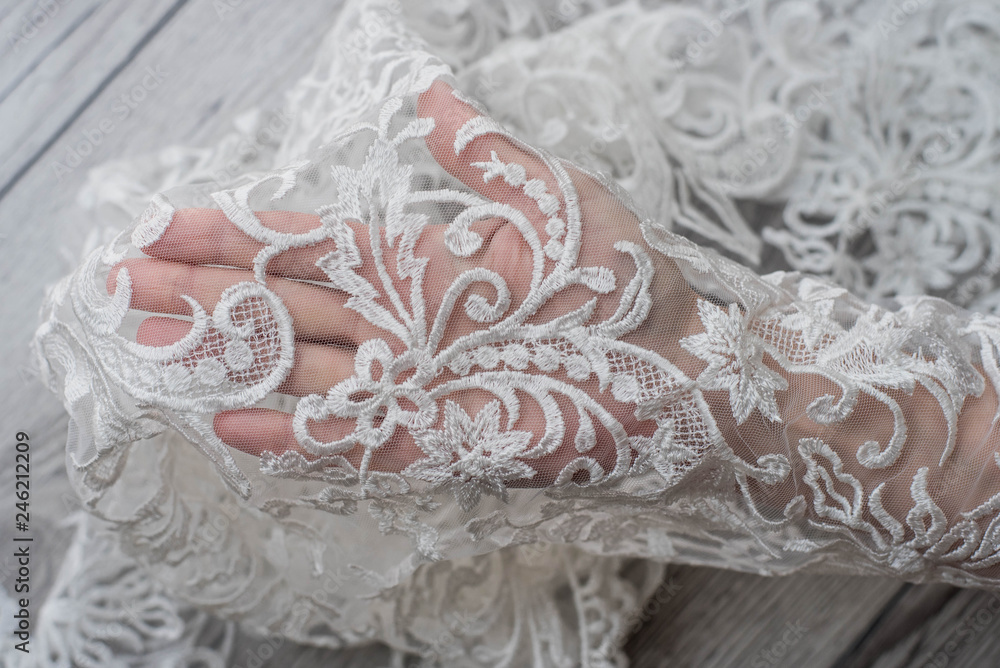 The texture of lace on wooden background The texture of lace on wooden background