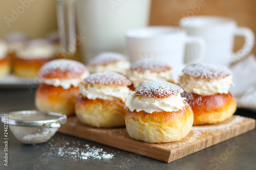 Homemade semla or vastlakukkel (in Estonia) is a traditional sweet roll with whipped cream made in Scandinavic and Baltic countries for Shrove Tuesday or related days photo