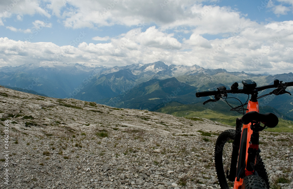 detail of an electric bike, e-bike, ebike, mtb, rock mountains, Dolomites,  unesco heritage, Madonna di Campiglio, summer, sport, adventure, travel,  Alps, Trentino, Alto Adige, Italy Stock Photo | Adobe Stock