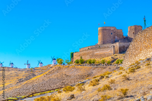 Castle at Consuegra surrounded with white windmills, Spain