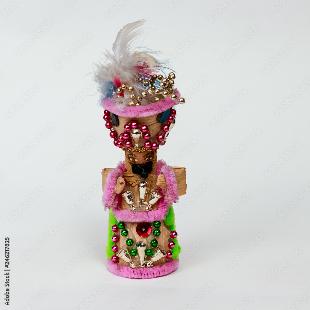 Single traditional wooden handicraft carnival doll toy front isolated in white background (center shot) Single traditional wooden handicraft carnival doll toy front isolated in white background (center shot)