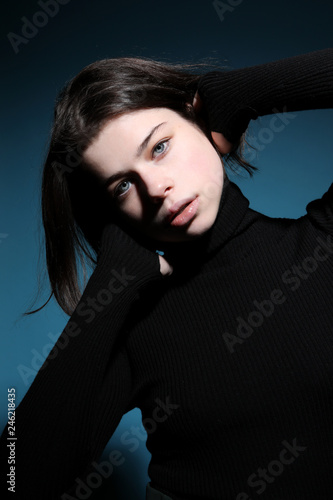 Portrait of young woman with black hair
