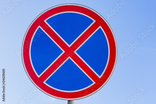 Road sign prohibiting a stop against a blue sky