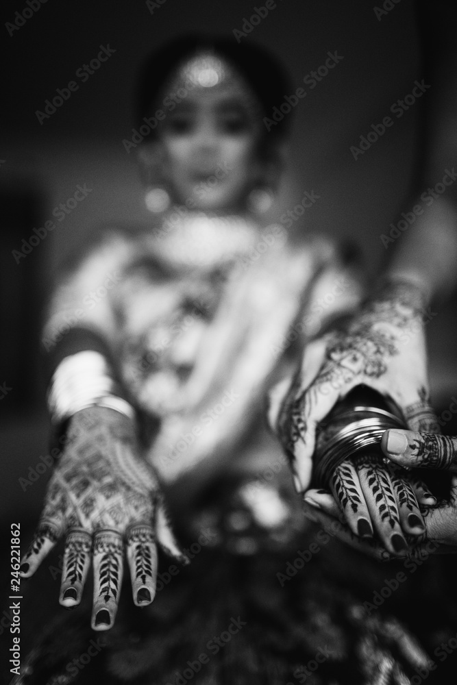 Hindu bride shows her wedding rings on the hands with henna tattoos Stock  Photo | Adobe Stock