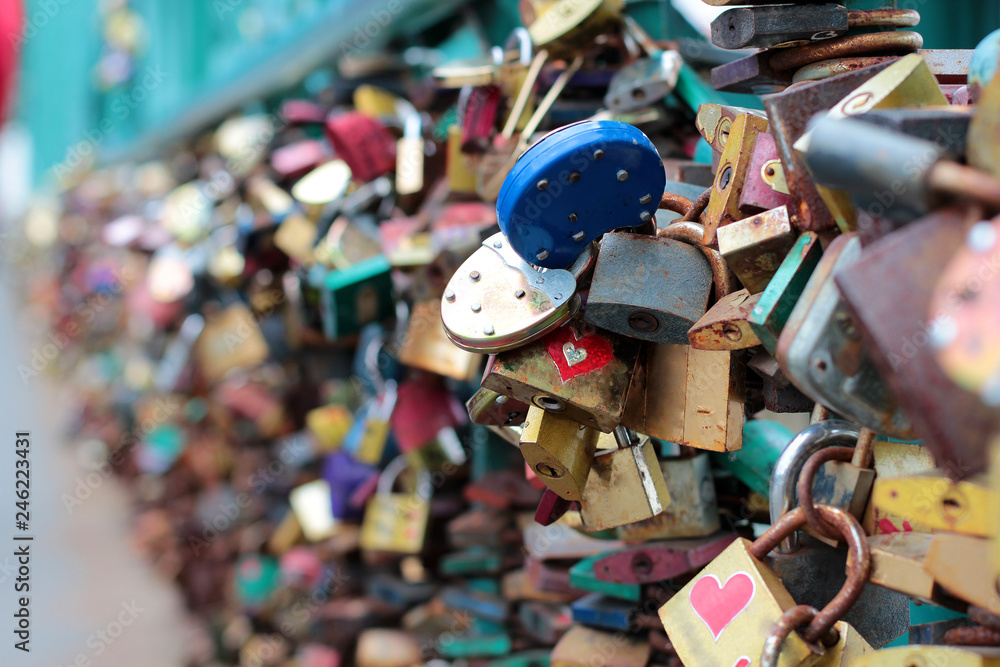 Fototapeta premium Many wedding locks on the bridge in Prague. Beautiful wedding background. Background for wedding photo books.