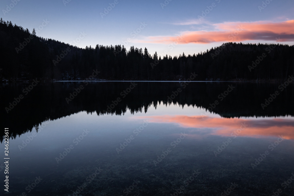 scenic mirror reflection on fusine lakes in sunset, italy scenic mirror reflection on fusine lakes in sunset, italy